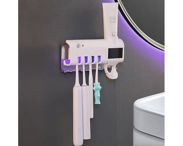 Dozator pentru pasta de dinti cu alimentare solara si sterilizator UV pentru periute