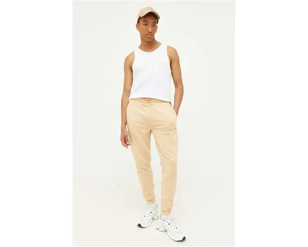 Tommy Jeans pantaloni de trening culoarea bej, cu imprimeu