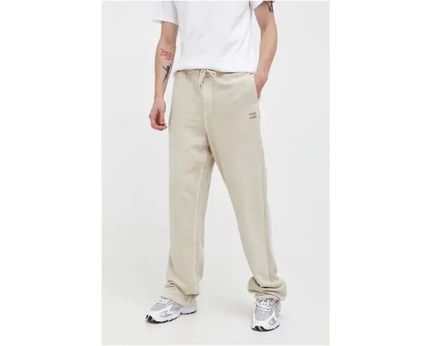 Tommy Jeans pantaloni de trening din bumbac culoarea bej, neted