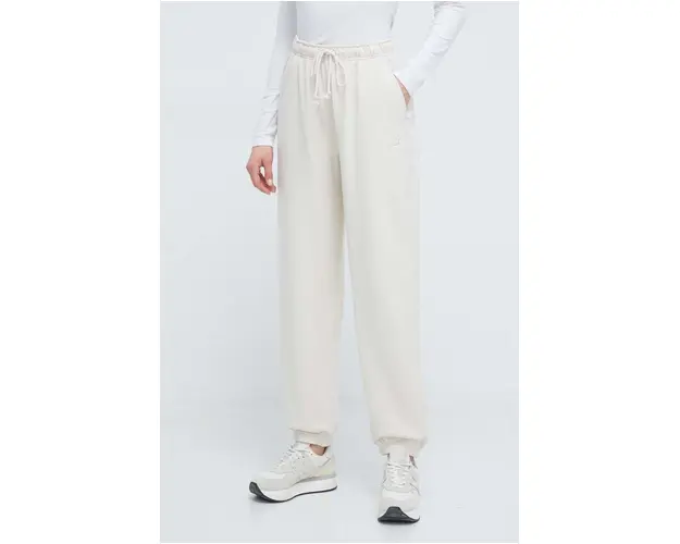 New Balance pantaloni de trening din bumbac culoarea bej, neted