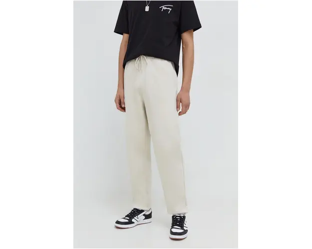 Tommy Jeans pantaloni de trening din bumbac culoarea bej, uni DM0DM18378