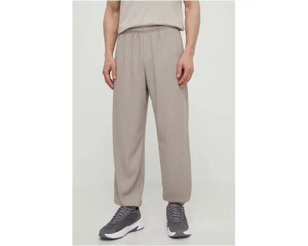 Under Armour pantaloni de trening culoarea bej, neted